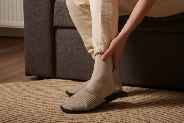 istock Woman dealing with ankle pain. 2201783740
