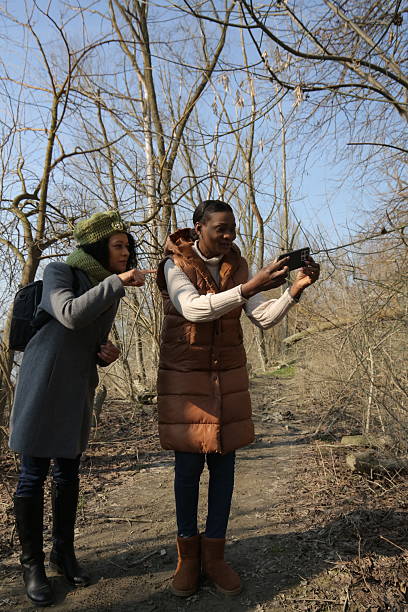 istock Hikers taking pictures with smartphone in forest 2201784618