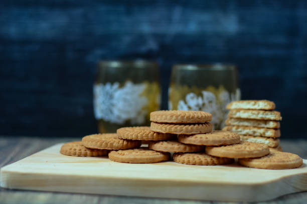 stack of biscuits stacked against a backdrop of antique glass