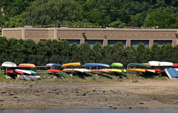 istock Colorful Canoes Stored by the Waterfront 2201790361