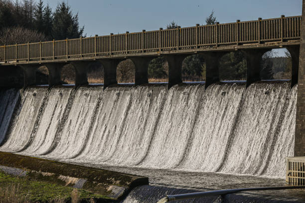 istock Reservoir spillway - water cascading down the spillway structure in large volumes - providing safe drinking water to the country 2201791457
