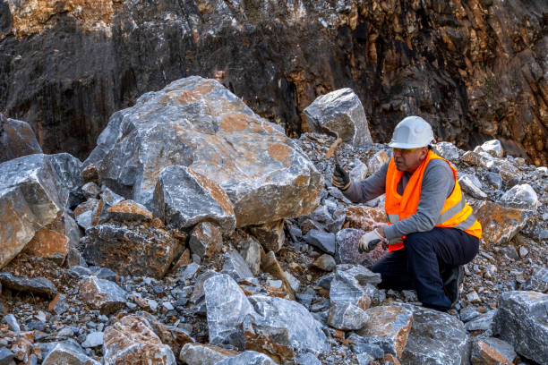 istock Geologist inspecting a mine,Explorers collect soil samples in search of minerals. 2201791503