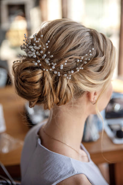 Luxurious wedding pearl hairpin on a bright head