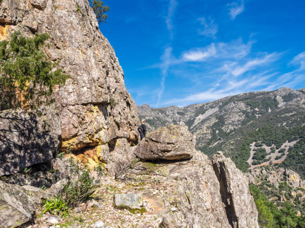 istock Hiker admiring nature on rocky terrain 2201793743