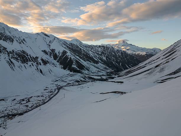 istock high relief mountains covered with snow, mountain range, aerial view drone shot 2201795155