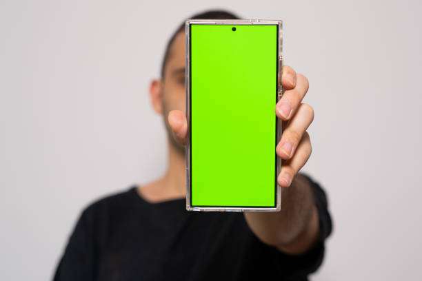 istock Person Holding Smartphone with Green Screen 2201795400