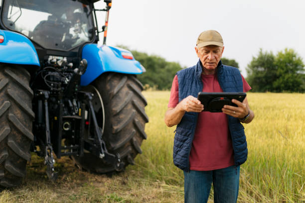 istock Elderly male farmer practicing smart farming with digital tablet 2201798956