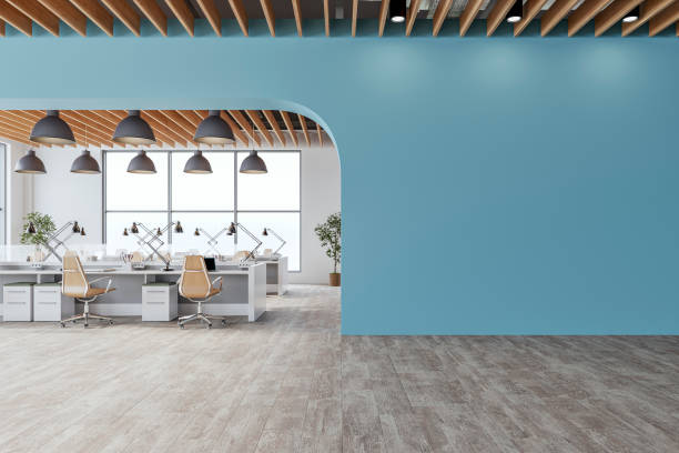 istock Semi-empty office interior with arched light blue wall and copy space,  a wooden slats ceiling, work desks and large windows, on wood look tiled floor 2201799783