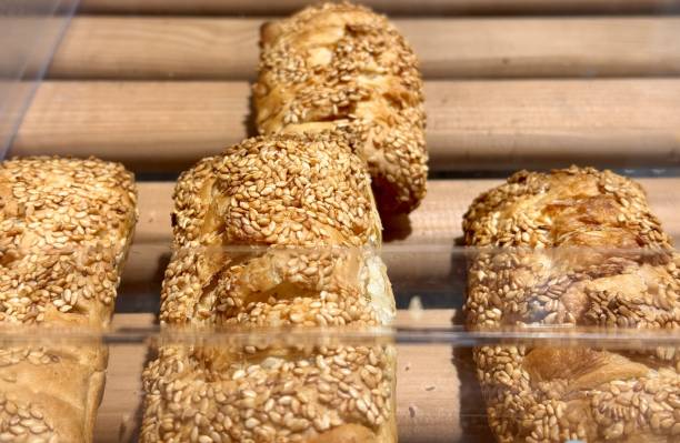 A delightful closeup image of scrumptious sesame pastries, highlighting their perfectly golden and crispy crust. Close-up