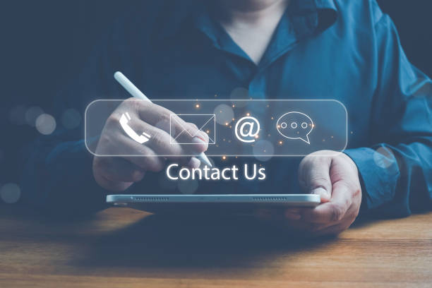 istock Concept of contact us, customer support, service, icon, Contact us or Customer support hotline people connect. Businessman using a laptop with the (email, call phone, mail) icons. customer service. 2201802247