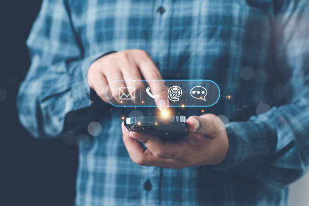 istock Concept of contact us, customer support, service, icon, Contact us or Customer support hotline people connect. Businessman using a laptop with the (email, call phone, mail) icons. customer service. 2201802258