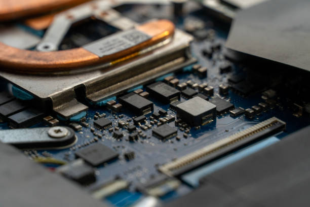 istock Detailed view of an electronic circuit board, highlighting various components such as transistors and capacitors in a workshop setting during assembly 2201803686
