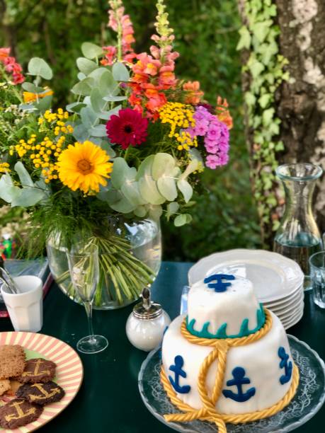istock Still life Buffet with flowers and cake maritime style 2201804233