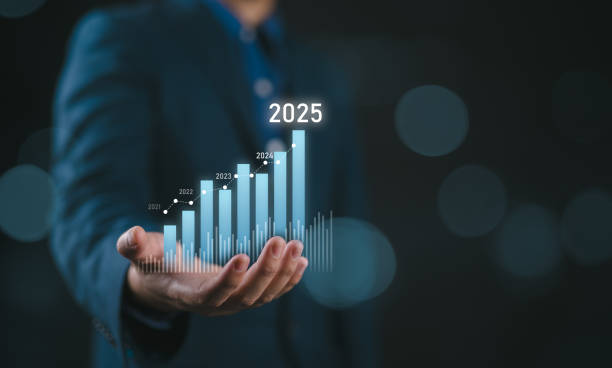 istock Businessman holding glowing virtual technical graph and chart for analysis stock market in 2025, technology investment and value investment concept. 2201804659