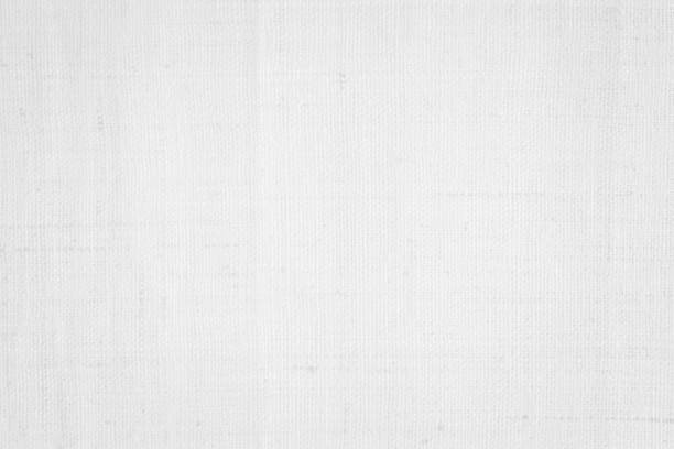istock White color fabric canvas woven texture background in pattern light blank. Natural gauze linen, carpet wool and cotton cloth textile textured as clean empty for decoration text. Grey sack material. 2201805009