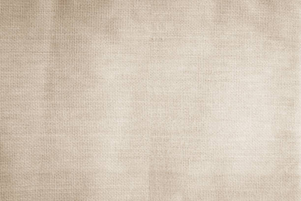 istock Brown sackcloth woven texture background in natural pattern. Jute hessian burlap, linen background in light beige cream color blank. Weaving canvas fiber line cotton cloth textured as organic. 2201805021