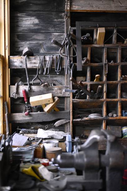 istock An old cabinet filled with tools, surrounded by the rustic atmosphere of a blacksmith workshop. 2201806246