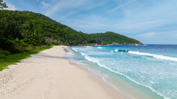 istock Secluded beach with footprints in sand. Seychelles, Mahe. 2201808208