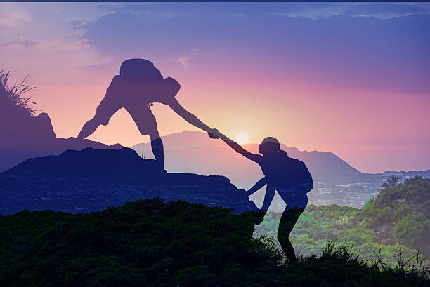 istock Giving a helping hand. People helping each other and teamwork concept. 2201809026
