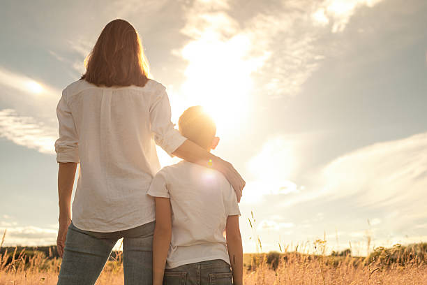 istock Mother and child spending time together outdoors in a countryside. 2201809031