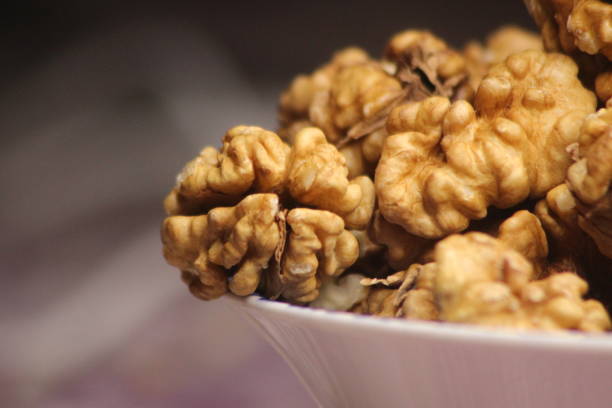 istock Extreme close-up of peeled walnuts 2201810713