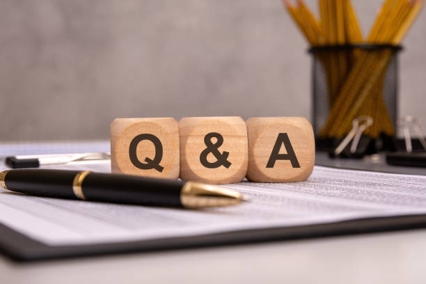 istock wooden cubes with 'Q A' on an office desk, symbolizing communication, support, and business discussions 2201814656