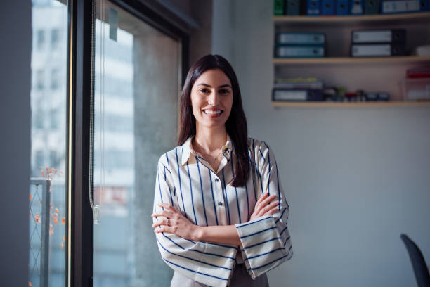 istock Confident Professional Woman Smiling in Modern Office Setting During Daytime 2201815661