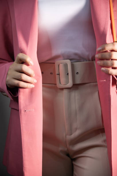 istock woman 's hand holding a suit 2201816282