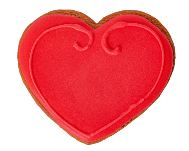 istock Gingerbread cookies in the shape of a red heart isolate on white. Valentine's Day concept. 2201816531