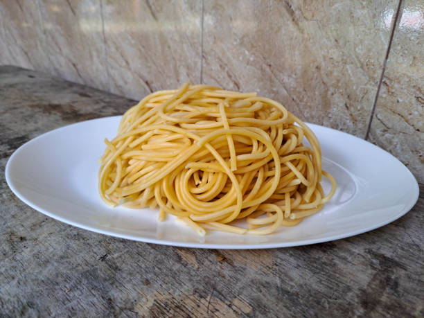 istock Tasty Plain Spaghetti On A Oval Plate. Food Menu. 2201818464