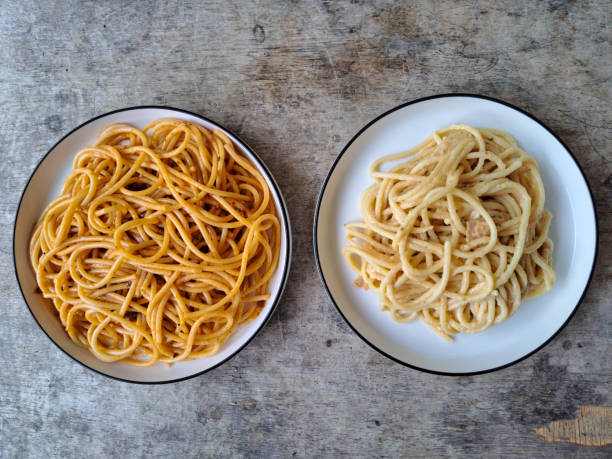 Spaghetti Bolognese And Spaghetti Carbonara On A Plate. Pasta Food Menu. Top View.