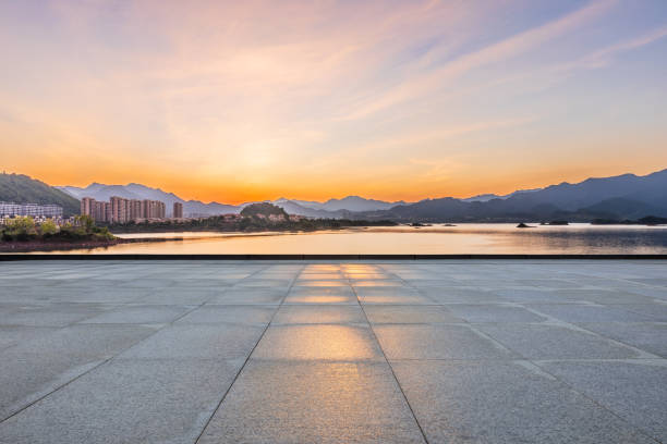istock Empty square floor and lake with mountain natural landscape at sunrise 2201821132