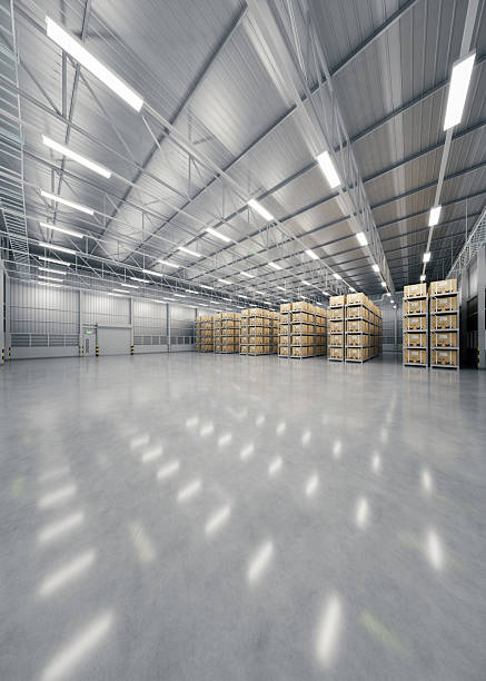3d rendering of warehouse industry building interior. known as distribution center, retail warehouse. Included cardboard box on shelf, empty space on concrete floor suit for industrial background.