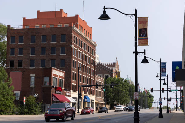 Kansas City, Kansas, USA - June 15, 2023: Afternoon traffic passes through the historic downtown urban core.
