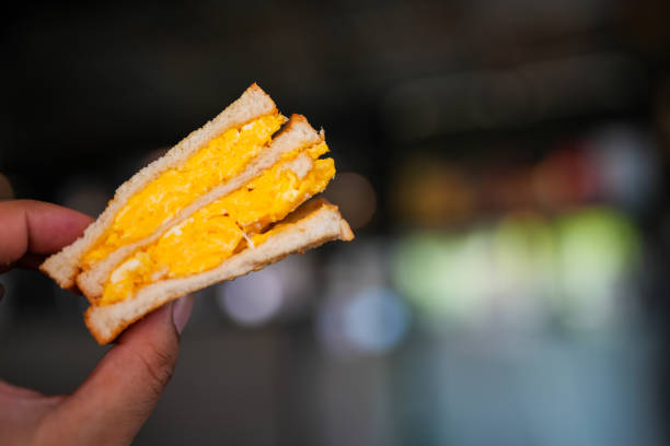 istock Egg salad sandwich on hand, delicious healthy breakfast 2201831085