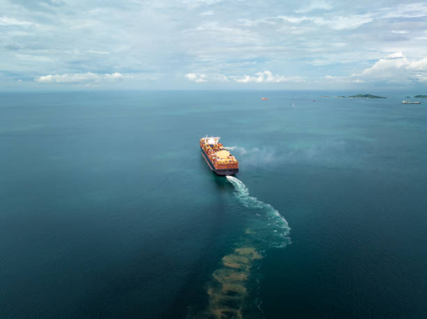 istock cargo container ship carrying sailing in sea import export goods and distributing products to dealer consumers across Asia pacific and worldwide global business transportation by container ship, rear view 2201831895