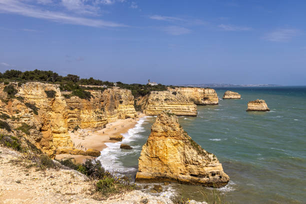 istock Praia da Marinha Beach among rock islets and cliffs seen from Seven Hanging Valleys Trail, Algarve, Portugal 2201832126