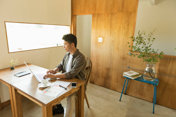 istock Middle-aged male freelancer who works from home 2201832153