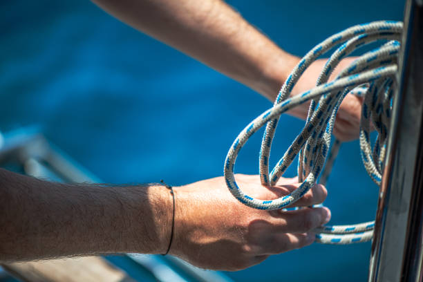 istock Securing the Sail: Tying Ship Rope and Knot on a Sail 2201833767