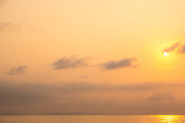 Panoramic skyline view The sun sets in the evening sky with colorful clouds. and beautiful cloud patterns In the soft light Evening at the sea
