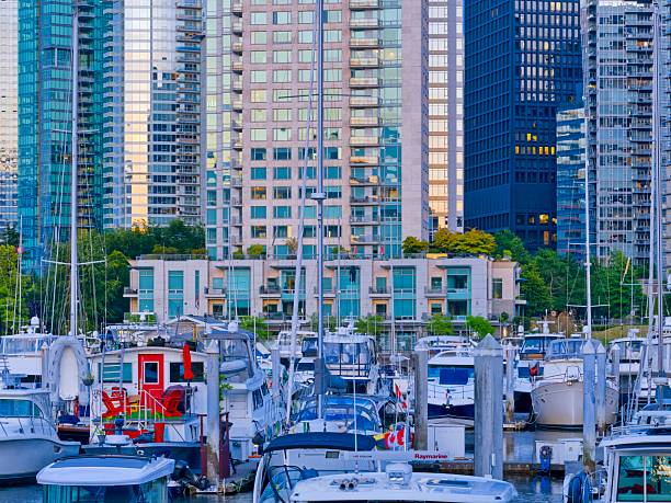 Evening view of Downtown Vancouver from Coal Harbor and Burrard Inlet, British Columbia