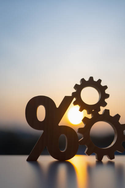istock Percentage model and gear model with evening sky Key concepts for success, methods, systems of raising or lowering Fed interest rates to correct inflation concepts. 2201836117