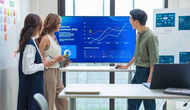 istock team of financial discussion business planning, analyzing digital financial data and strategy in a modern office 2201838332