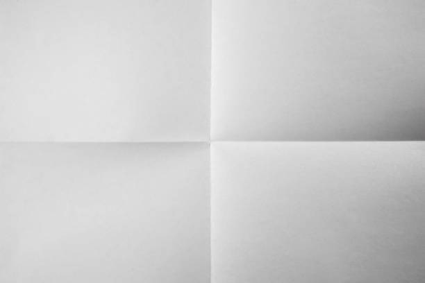 istock White paper folded. White paper folded against the background of four fractions 2201838647