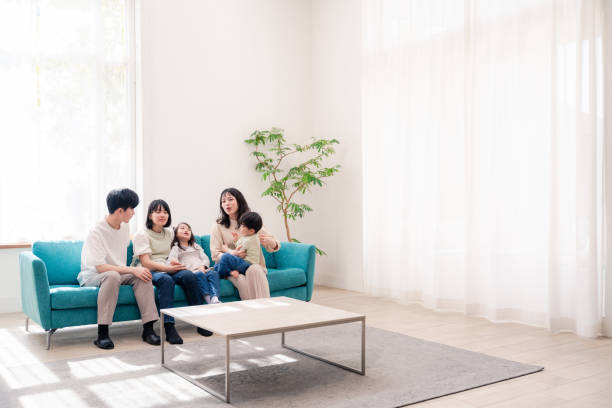 istock Family relaxing in the living room 2201840321