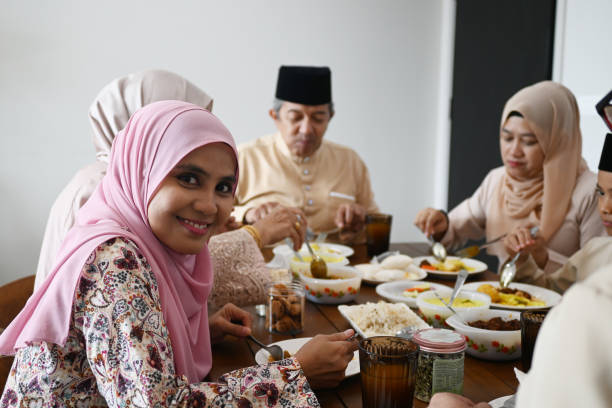 istock Young woman  taste the food during Iftar Ramadan 2201840396
