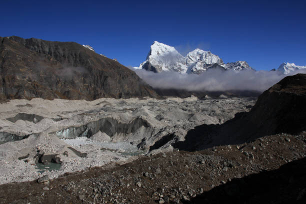 Ngozumpa Glacier and high mountains Cholatse and Taboche, Nepal.