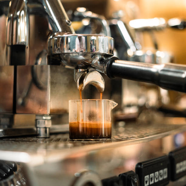 istock Espresso machine pouring hot coffee in a cafe 2201841690