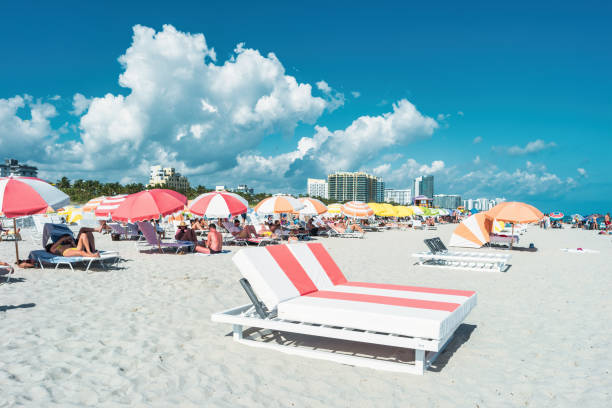 People enjoy South Beach in Miami Beach, Florida, USA on a sunny day.