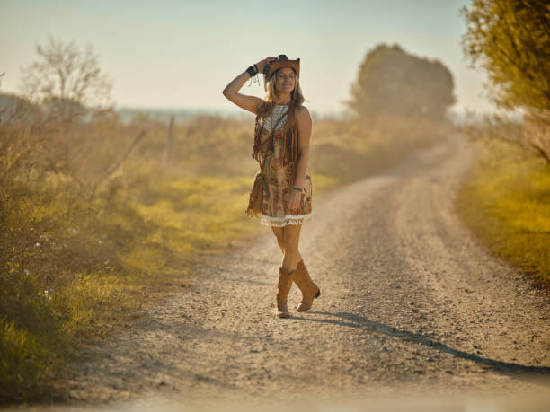 istock Smiling cowgirl enjoying in walk on a ranch. 2201846233